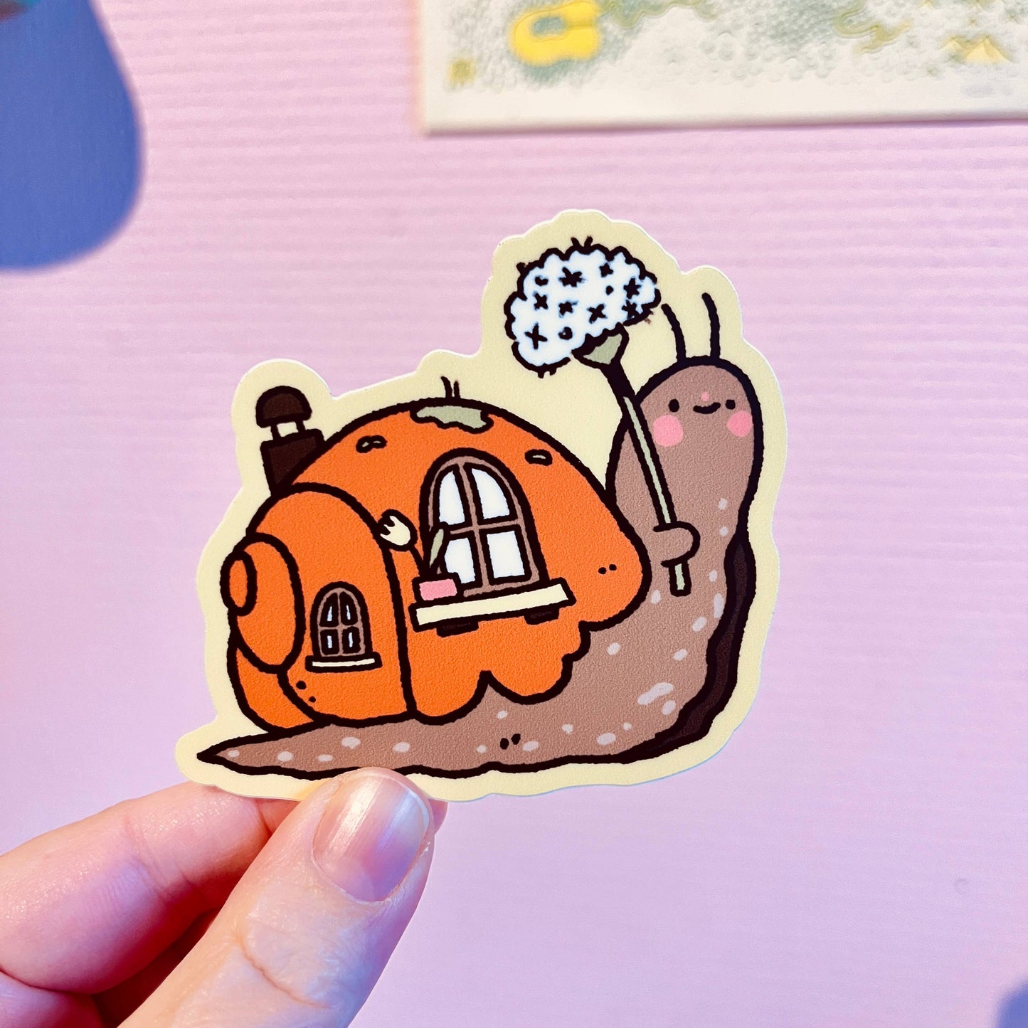 Snail moving house vinyl sticker