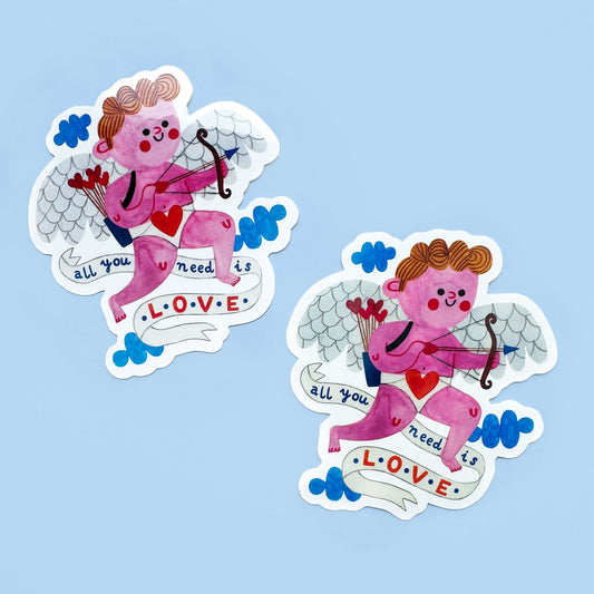 Two cartoon cupid stickers with 'All you need is love' text on a light blue background