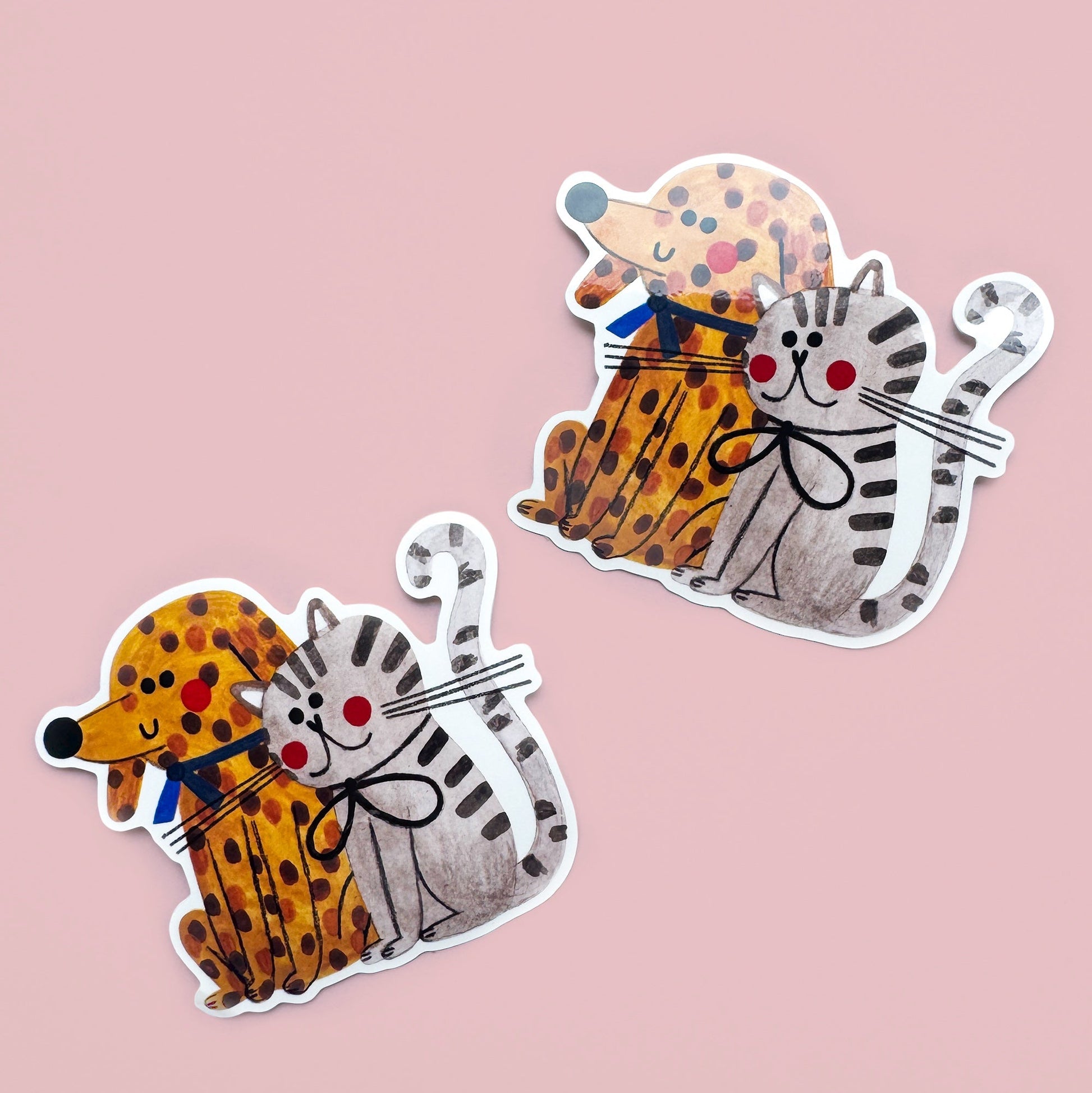 Two cartoon-style animal stickers on a pink background